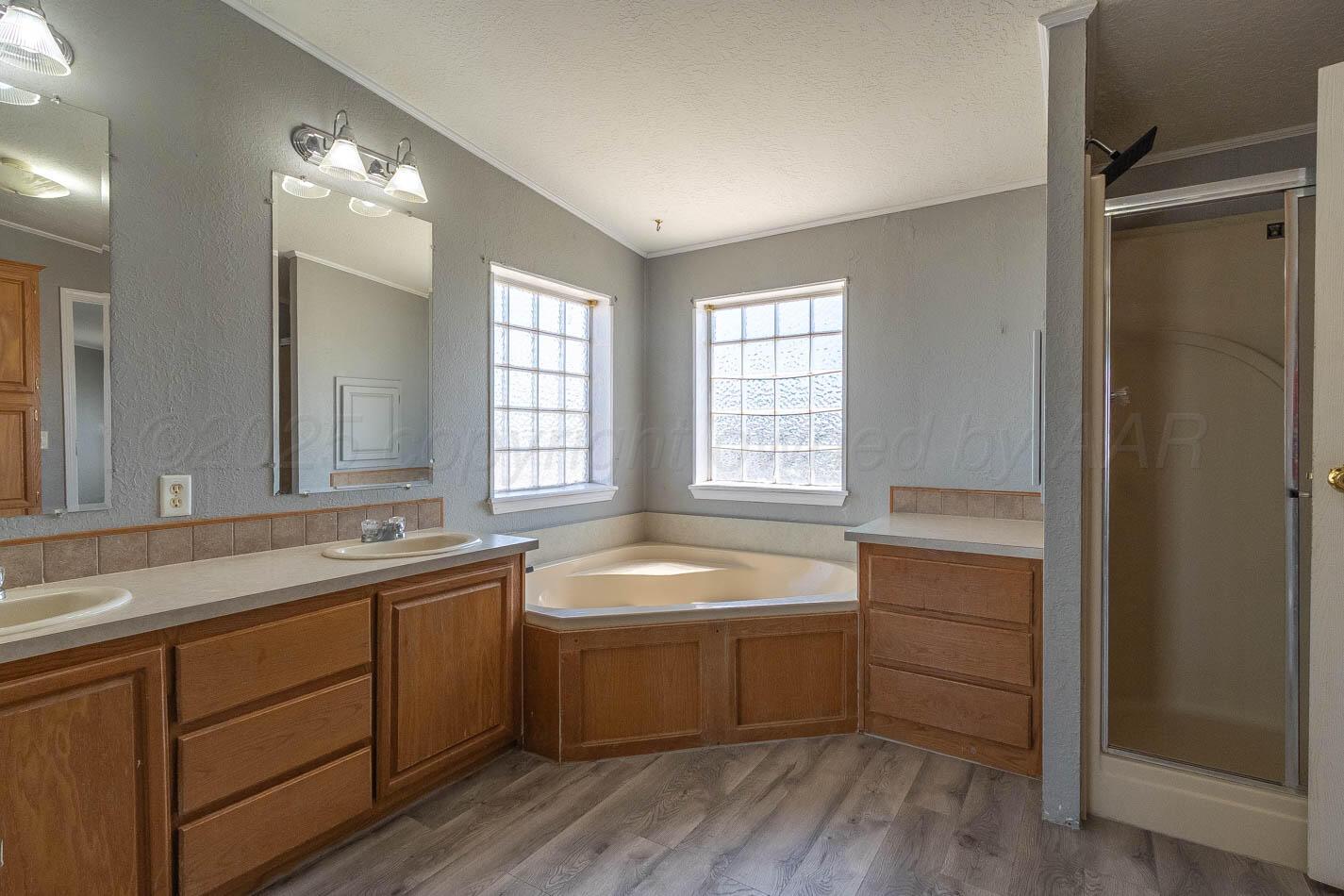5606 West McCormick Road Amarillo, TX 79118 - Photo 11 of 23 a kitchen with a sink and cabinets
