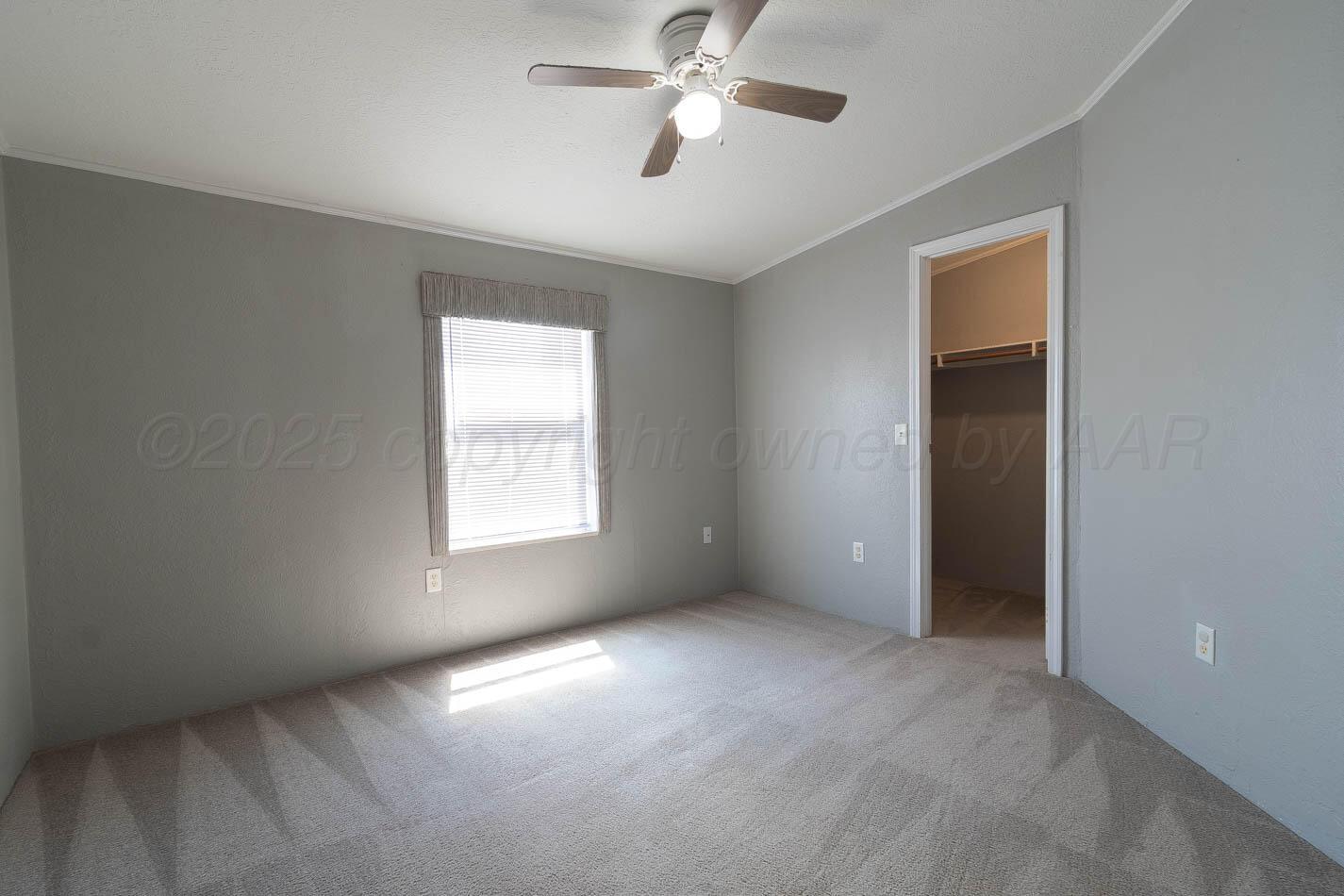5606 West McCormick Road Amarillo, TX 79118 - Photo 13 of 23 a view of an empty room with a window