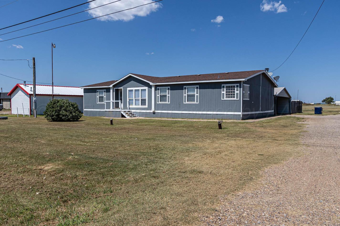 5606 West McCormick Road Amarillo, TX 79118 - Photo 2 of 23 a view of a house with a yard