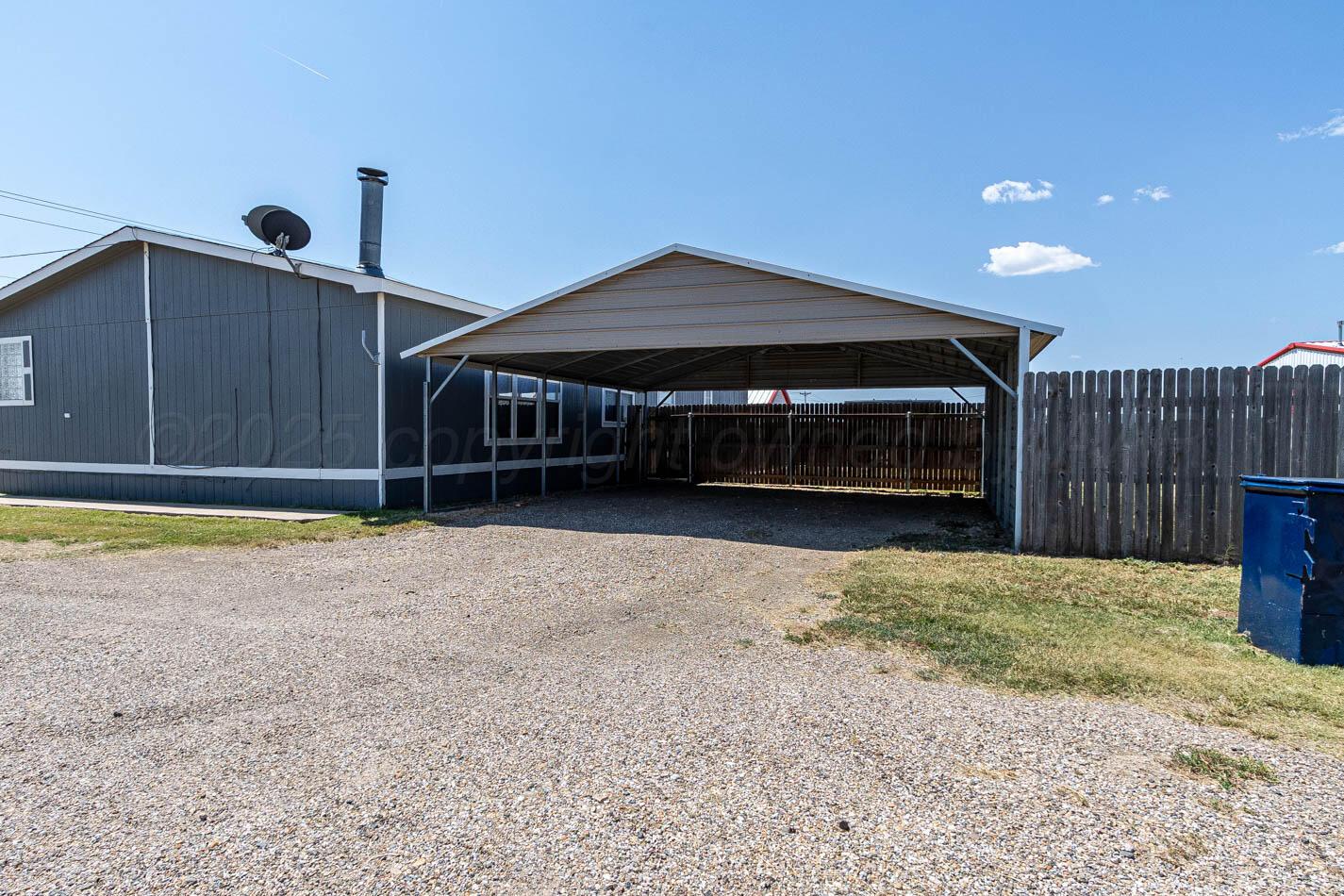 5606 West McCormick Road Amarillo, TX 79118 - Photo 21 of 23 a front view of a house with a yard