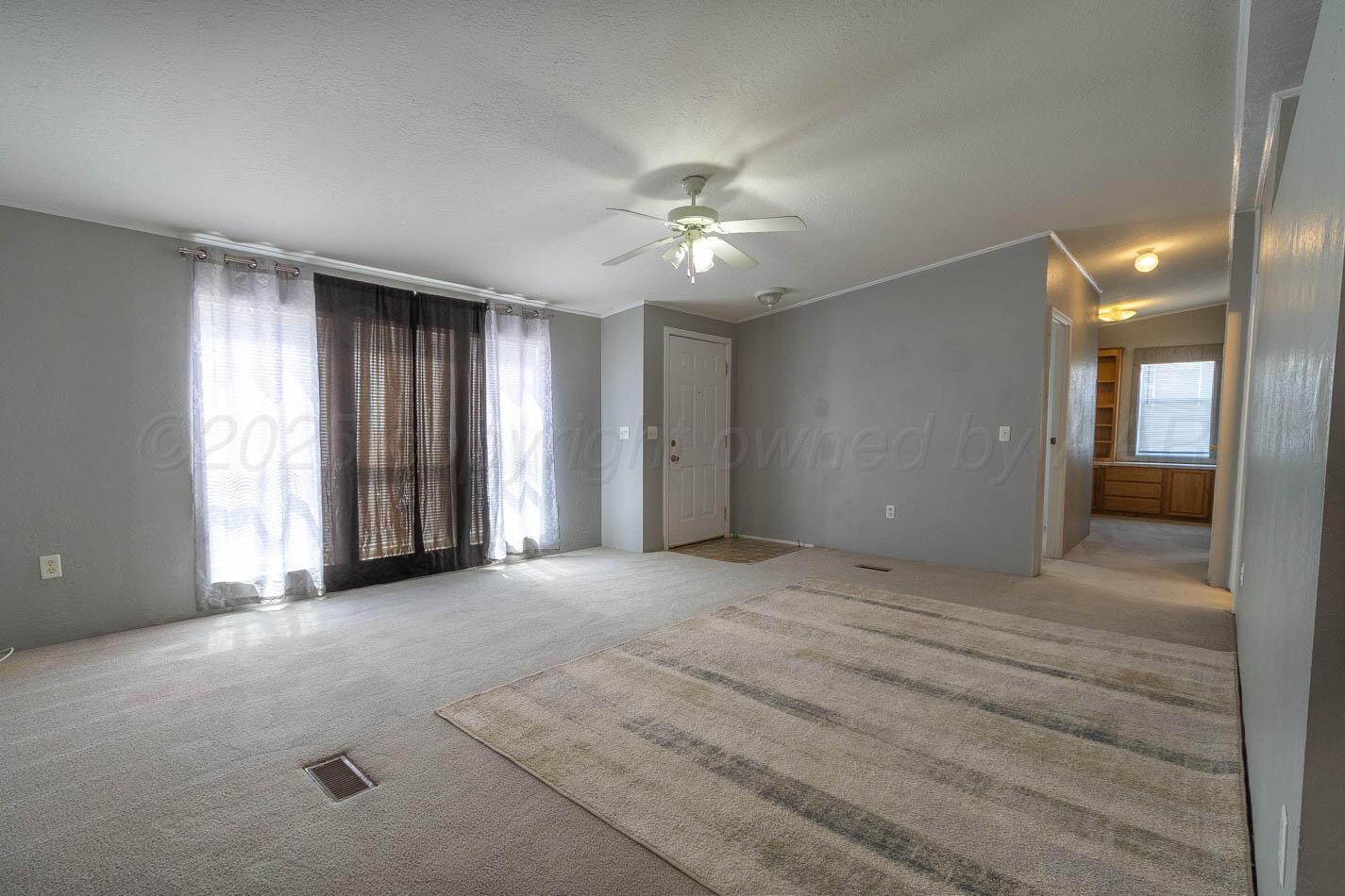 5606 West McCormick Road Amarillo, TX 79118 - Photo 4 of 23 a view of an empty room with a window