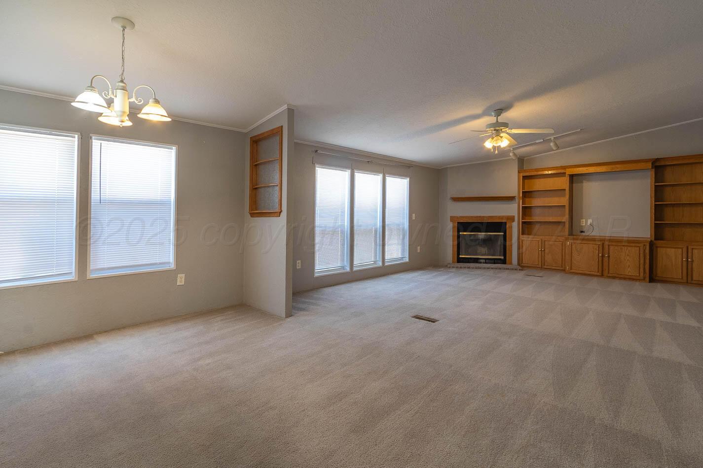 5606 West McCormick Road Amarillo, TX 79118 - Photo 5 of 23 a view of a livingroom with furniture and chandelier