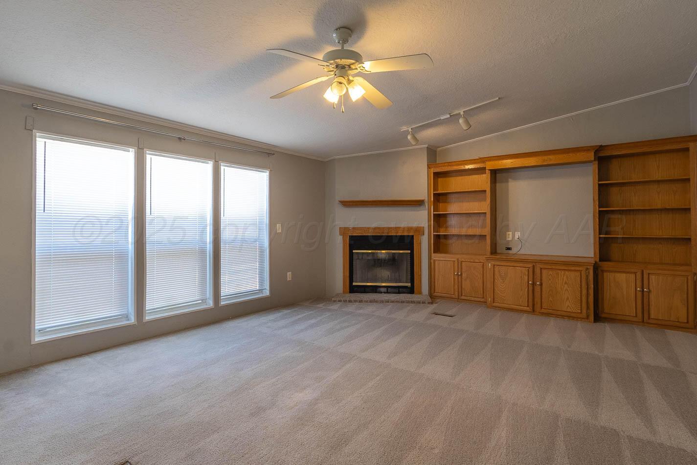 5606 West McCormick Road Amarillo, TX 79118 - Photo 6 of 23 a view of an empty room with a window