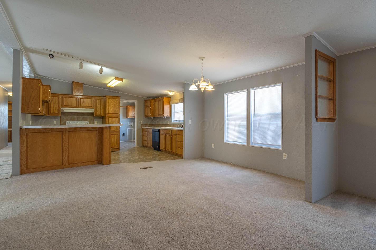 5606 West McCormick Road Amarillo, TX 79118 - Photo 7 of 23 a view of a kitchen with a sink stove cabinets and a kitchen