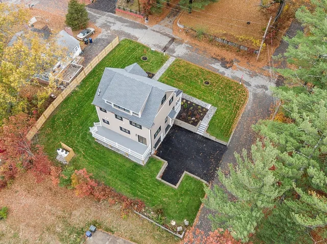 an aerial view of residential houses with outdoor space