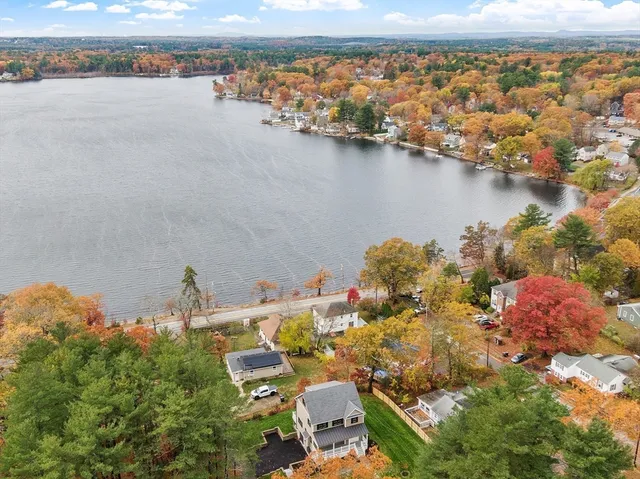 a view of a house with a yard and garage