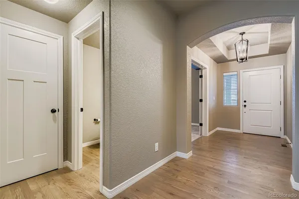 a view of entryway with wooden floor
