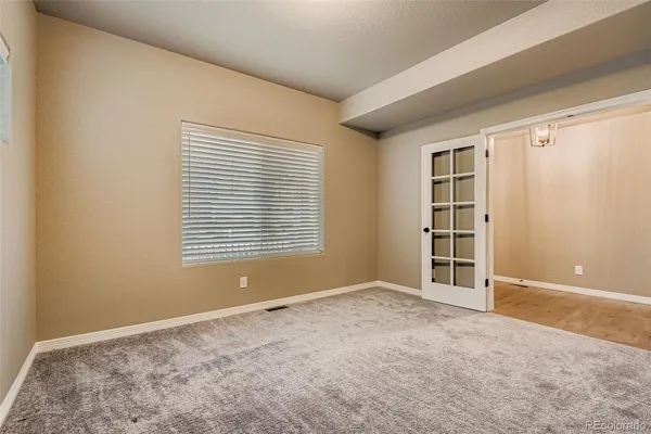 a view of an empty room with a window