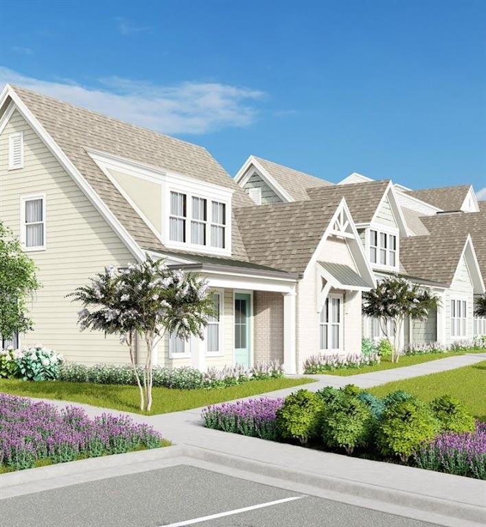 a front view of a house with a garden and plants