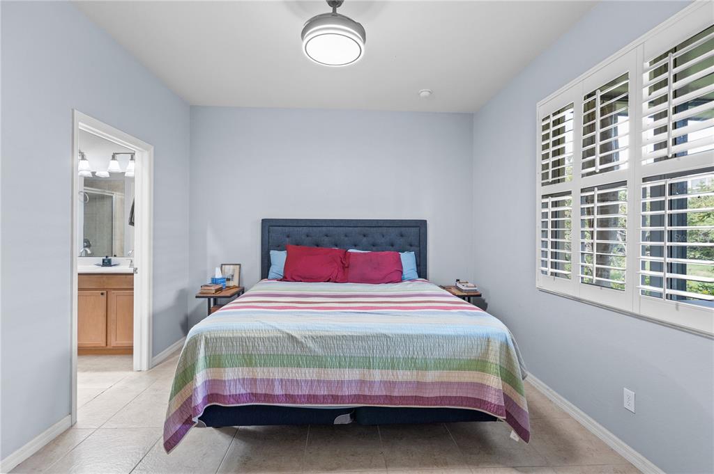 11815 Tempest Harbor Loop Venice, FL 34292 - Photo 15 of 63 a bedroom with a bed and window