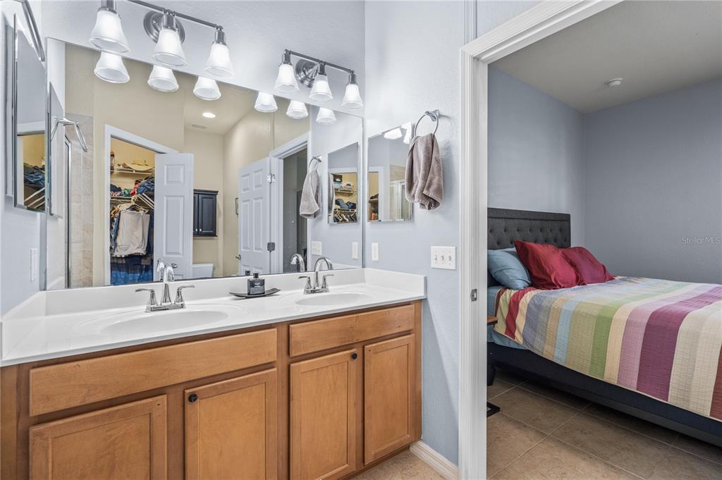11815 Tempest Harbor Loop Venice, FL 34292 - Photo 20 of 63 a en suite bathroom with a double vanity sink and a mirror
