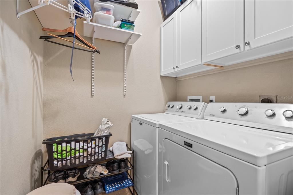 11815 Tempest Harbor Loop Venice, FL 34292 - Photo 26 of 63 a utility room with dryer and washer