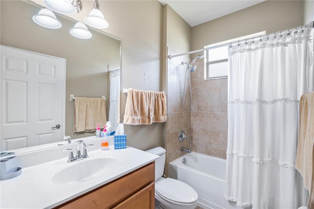 11815 Tempest Harbor Loop Venice, FL 34292 - Photo 27 of 63 a bathroom with a sink a toilet tub and shower