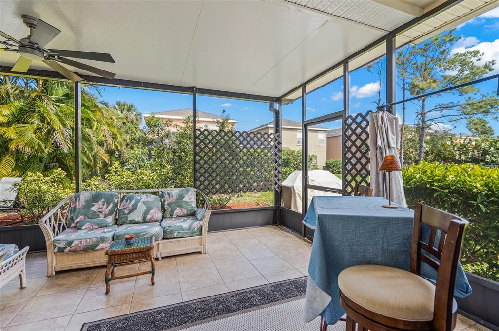 11815 Tempest Harbor Loop Venice, FL 34292 - Photo 29 of 63 a outdoor living space with furniture and a potted plant
