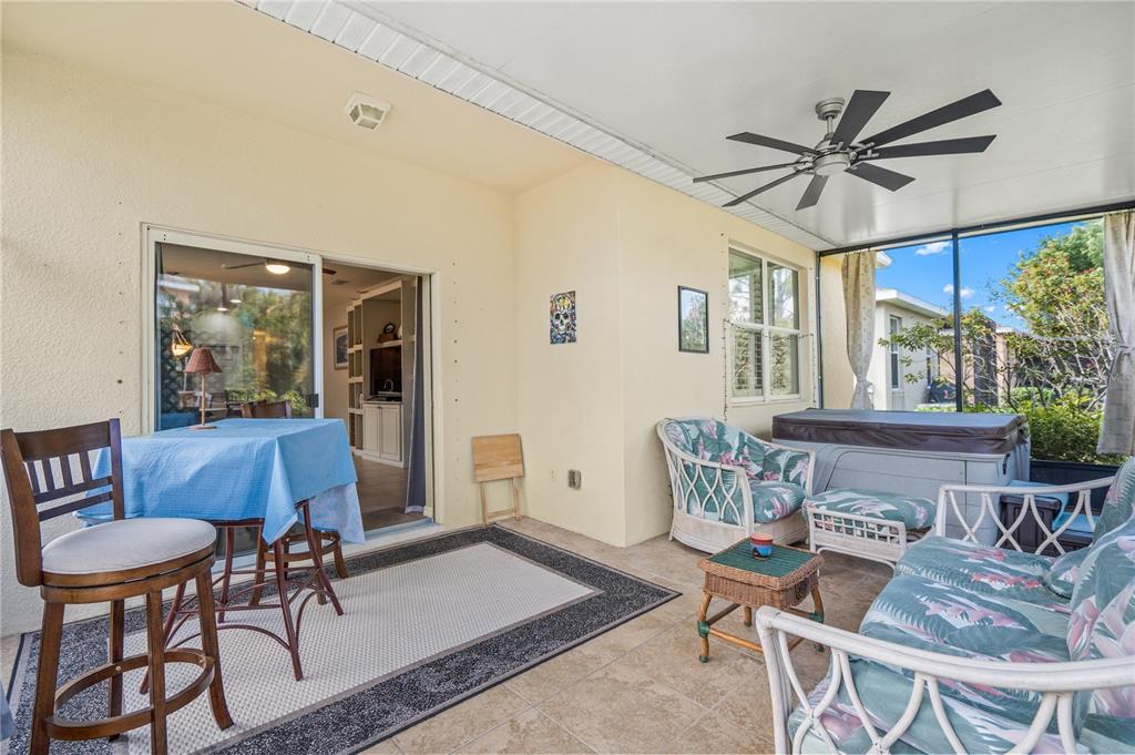 11815 Tempest Harbor Loop Venice, FL 34292 - Photo 30 of 63 a dining room with furniture a window and wooden floor