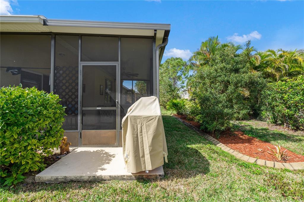11815 Tempest Harbor Loop Venice, FL 34292 - Photo 34 of 63 a backyard of a house with a garage