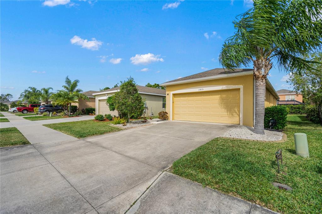 11815 Tempest Harbor Loop Venice, FL 34292 - Photo 4 of 63 a front view of a house with a yard and potted plants