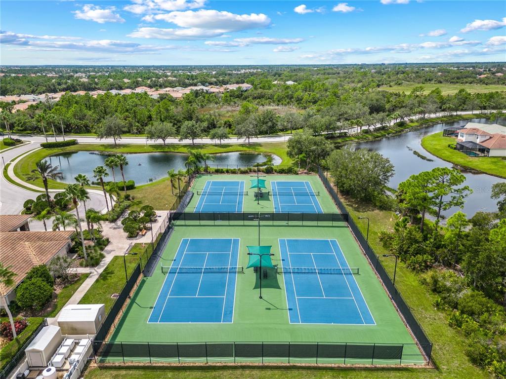 11815 Tempest Harbor Loop Venice, FL 34292 - Photo 42 of 63 a view of a swimming pool with an outdoor seating