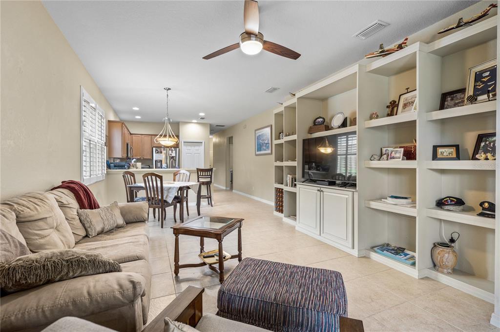 11815 Tempest Harbor Loop Venice, FL 34292 - Photo 8 of 63 a living room with furniture and a flat screen tv