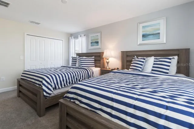 a bedroom with double bed and a window