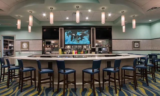 a kitchen with a table and chairs in it