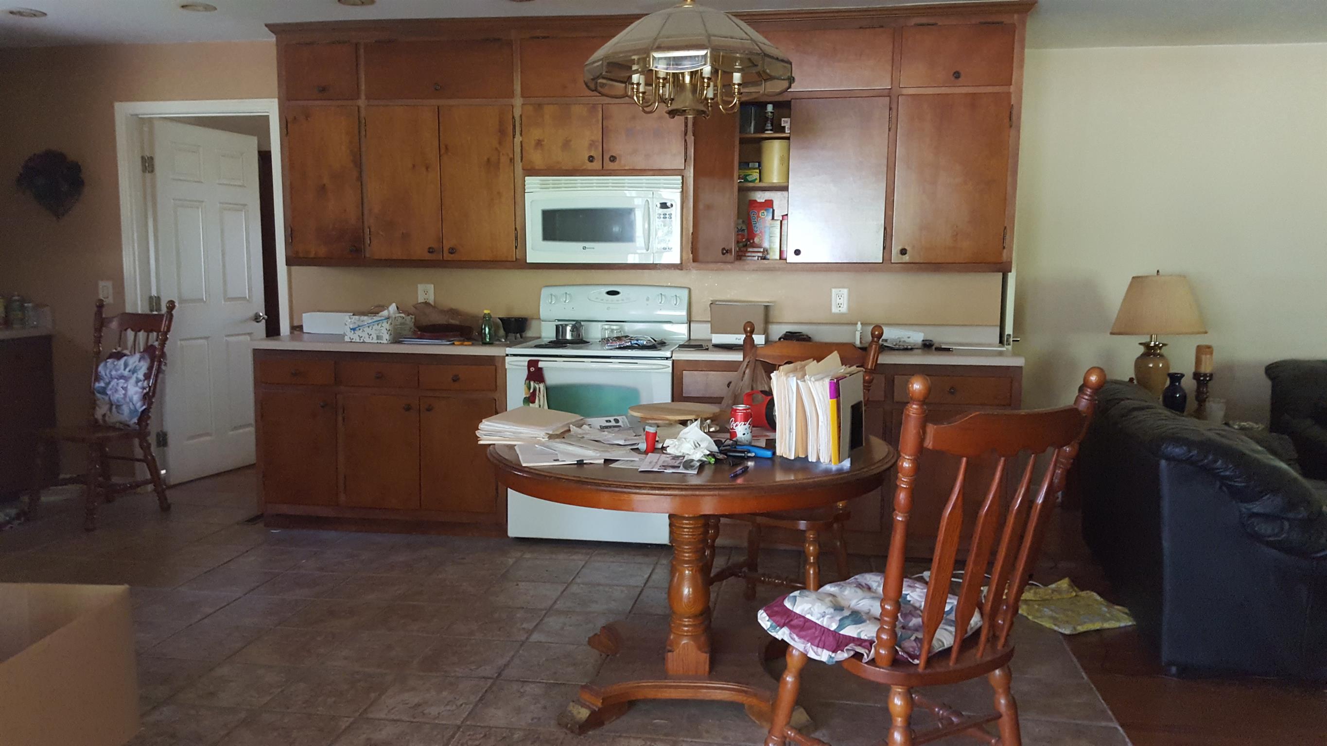 2760 Old Laguardo Road East Lebanon, TN 37087 - Photo 12 of 30 a kitchen with a dining table chairs and a refrigerator