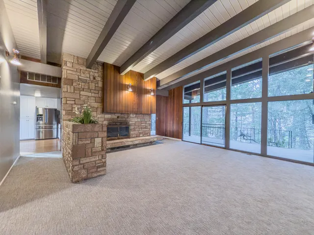 a view of an empty room with a fireplace