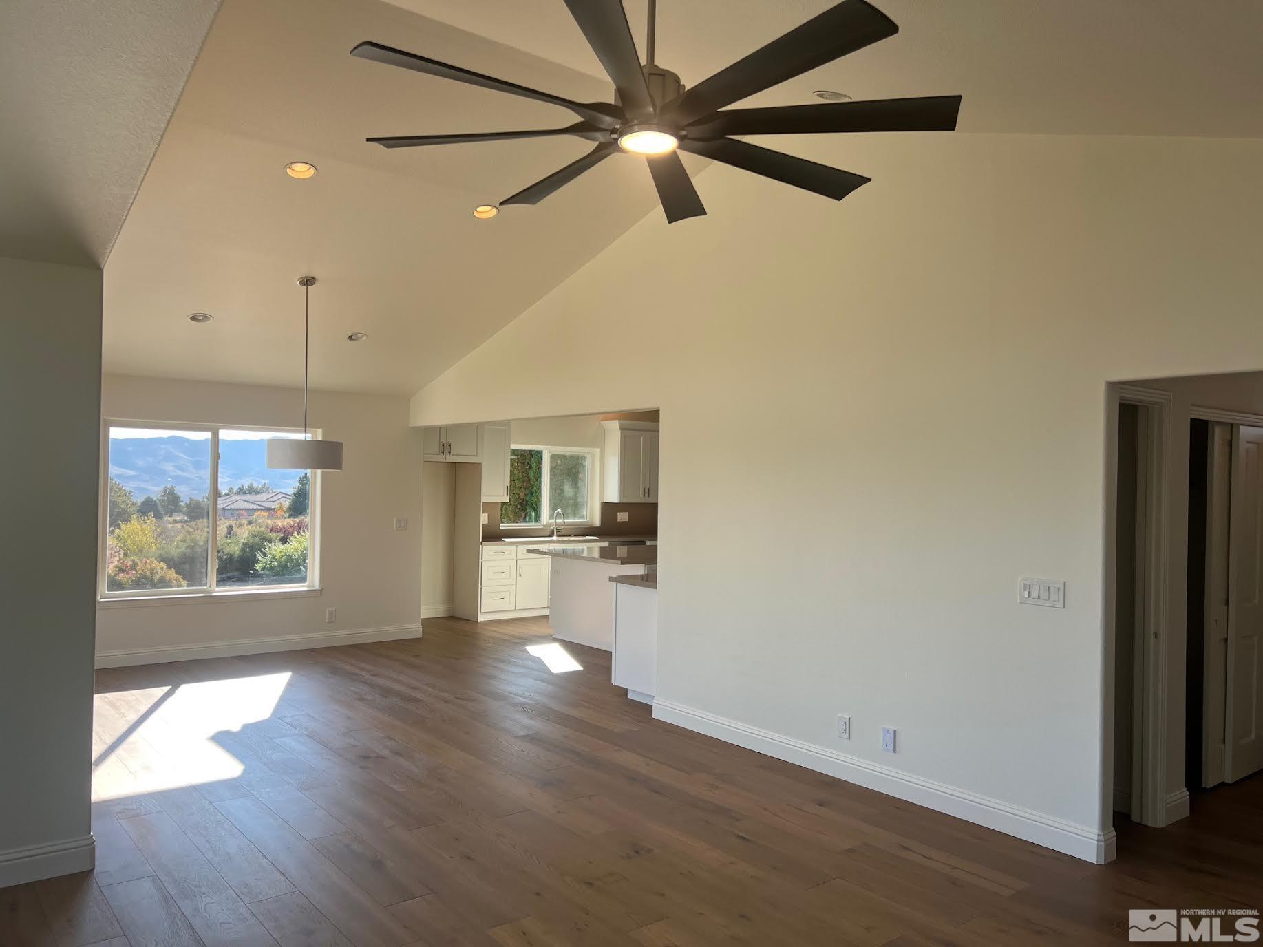 14230 Prairie Flower Court Reno, NV 89511 - Photo 11 of 39 a view of empty room with wooden floor and fan
