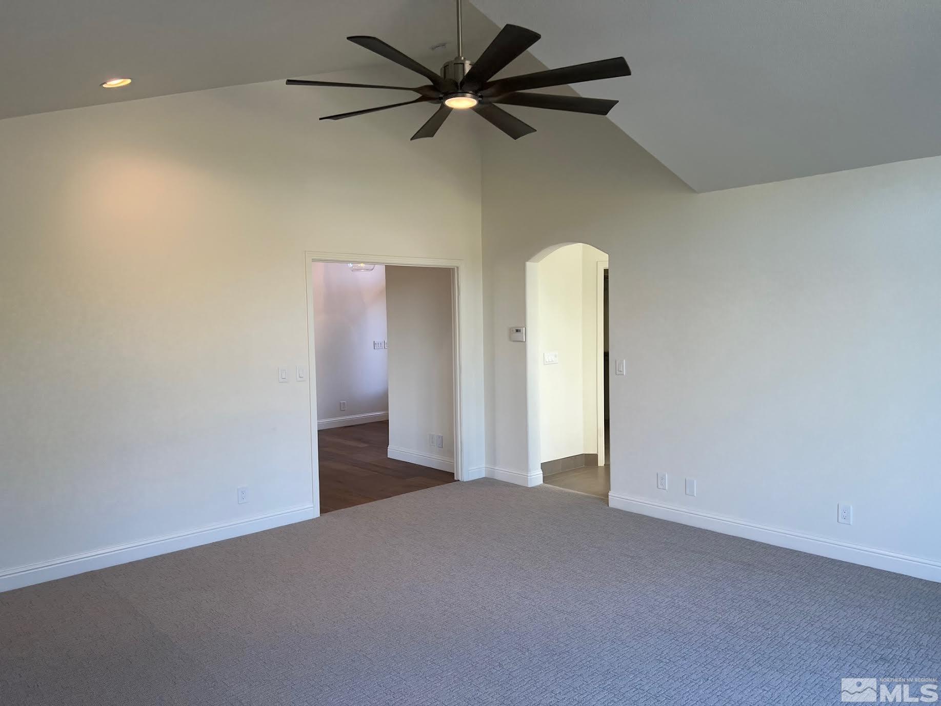 14230 Prairie Flower Court Reno, NV 89511 - Photo 14 of 39 a view of a livingroom with a ceiling fan and window
