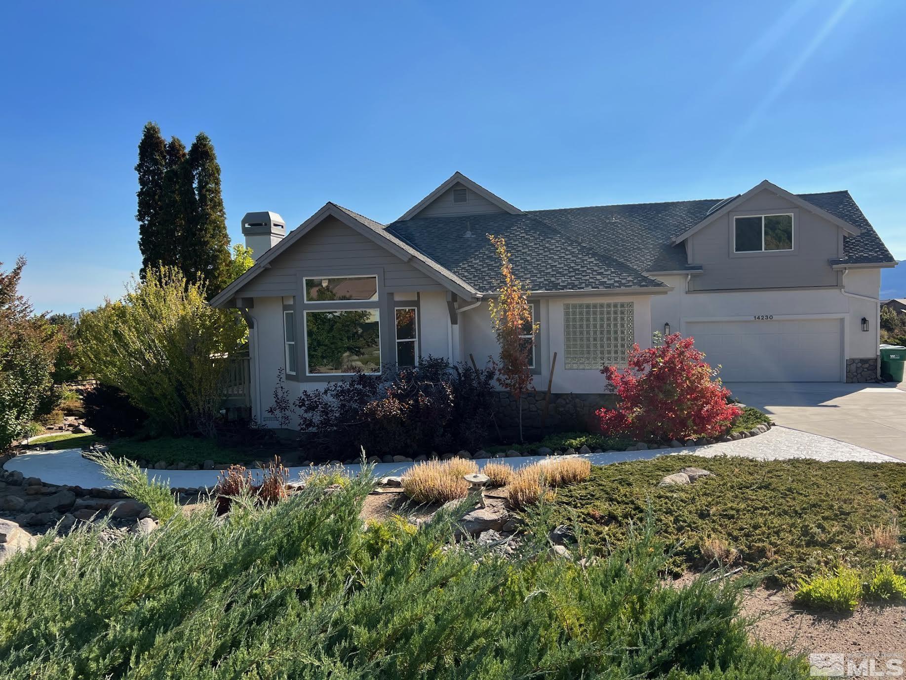 14230 Prairie Flower Court Reno, NV 89511 - Photo 2 of 39 a front view of a house with a yard