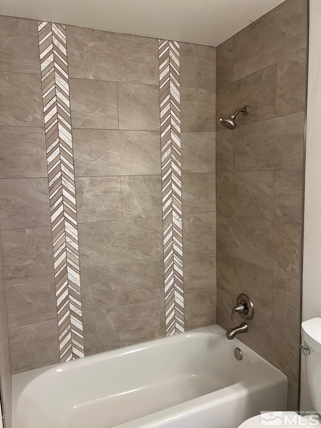 14230 Prairie Flower Court Reno, NV 89511 - Photo 22 of 39 a bathroom with a bathtub and shower