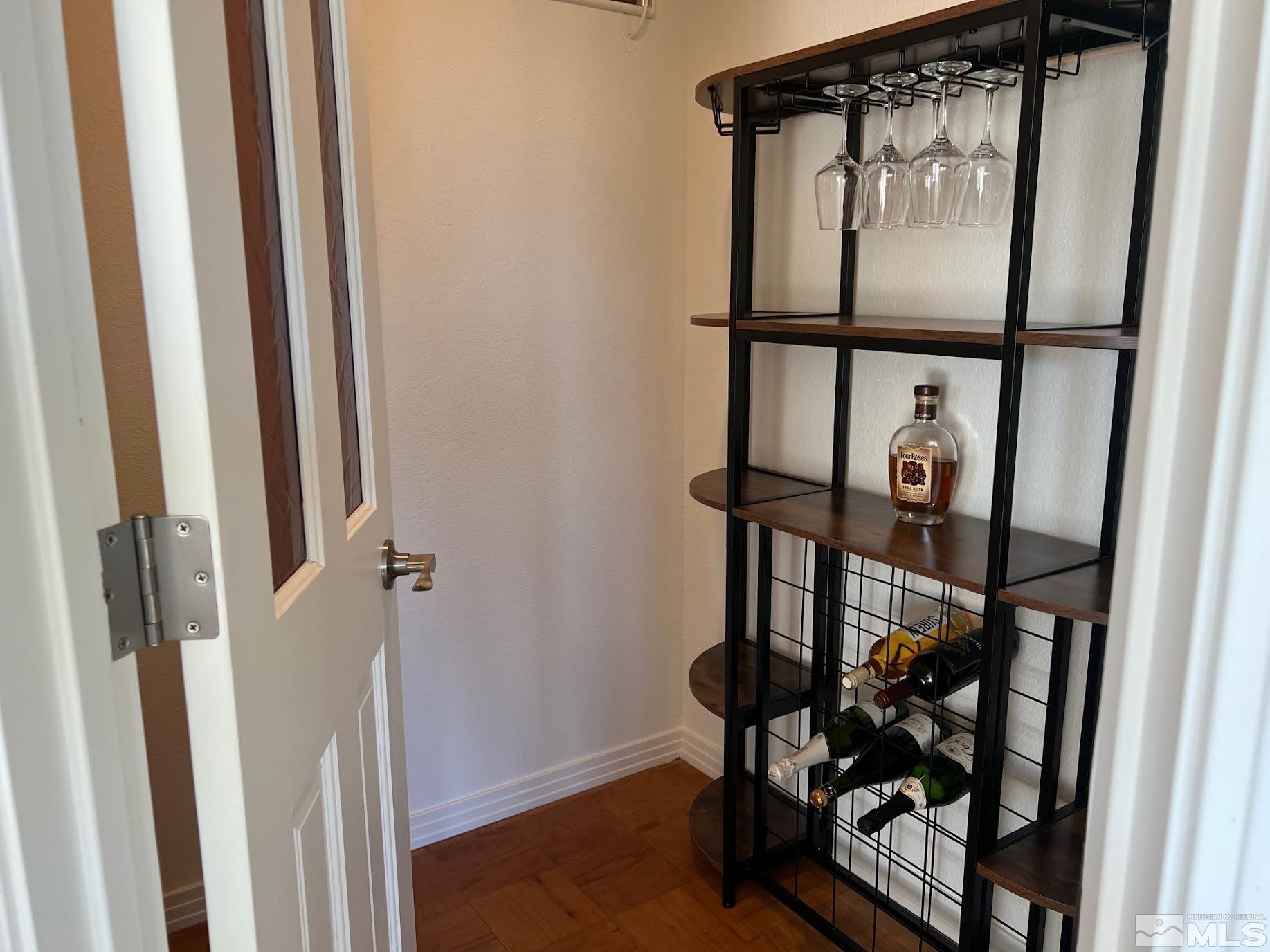 14230 Prairie Flower Court Reno, NV 89511 - Photo 27 of 39 a view of a hallway with wooden floor and entryway