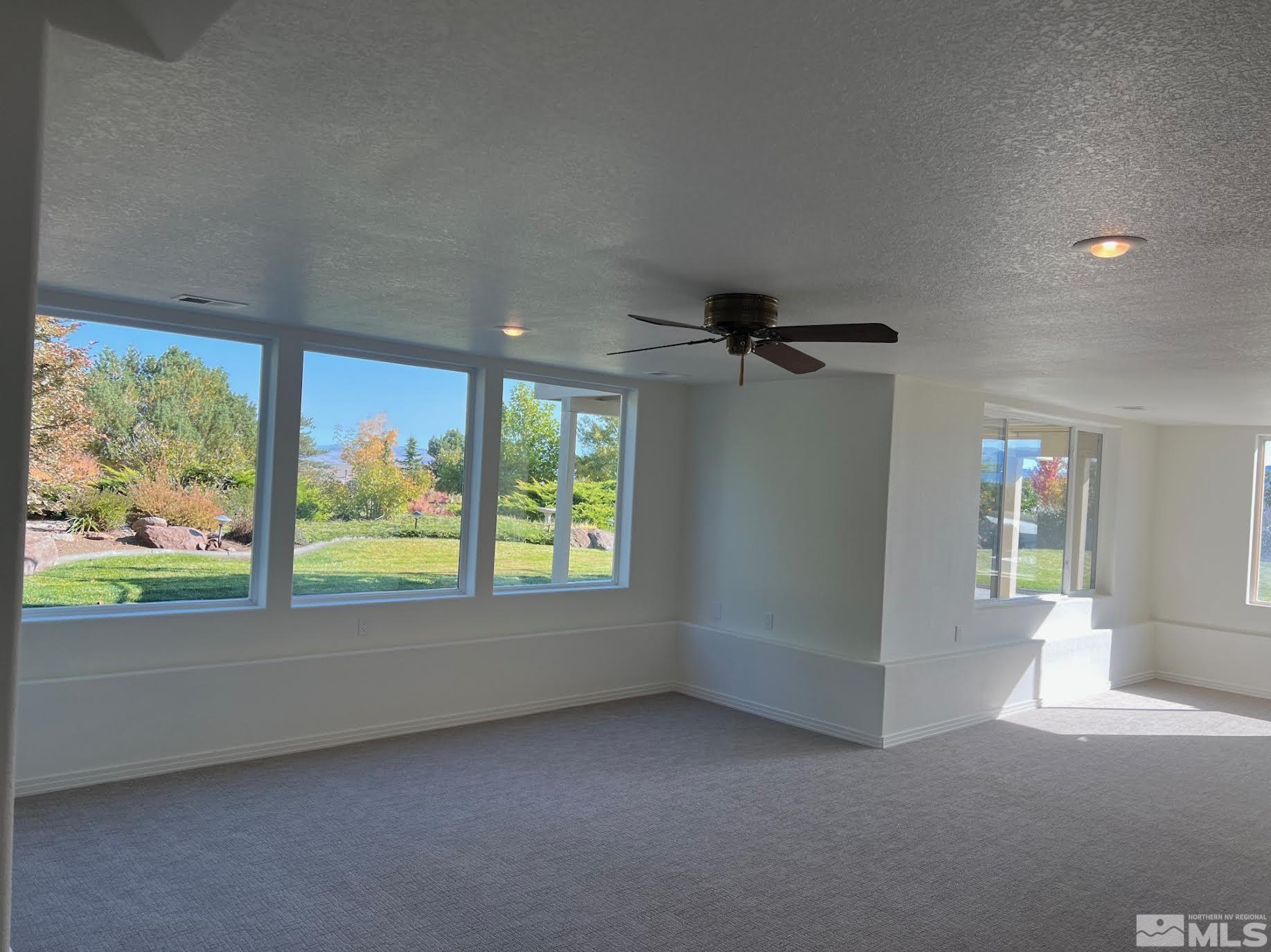 14230 Prairie Flower Court Reno, NV 89511 - Photo 29 of 39 an empty room with windows and entrance