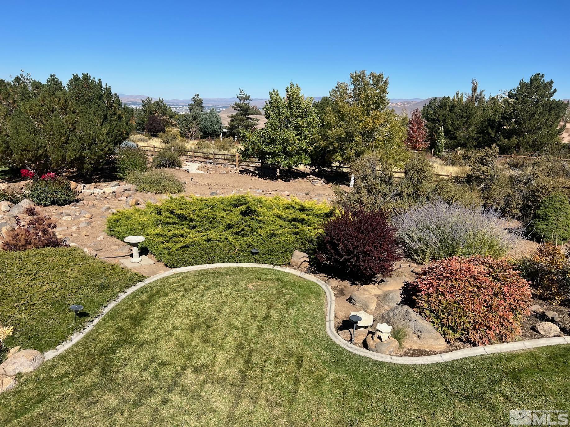 14230 Prairie Flower Court Reno, NV 89511 - Photo 36 of 39 a view of a garden with a tree