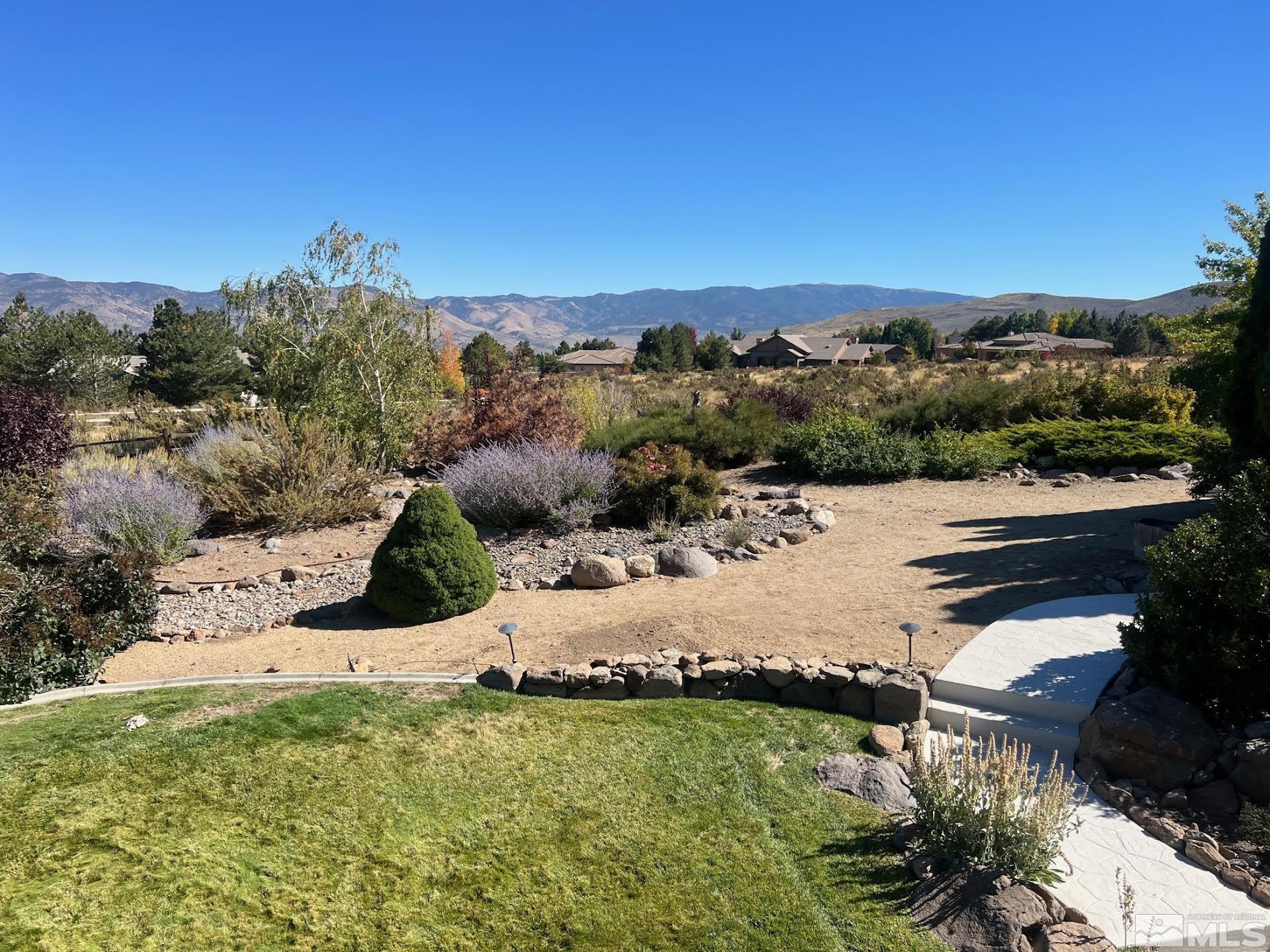 14230 Prairie Flower Court Reno, NV 89511 - Photo 37 of 39 a view of a lake with a yard