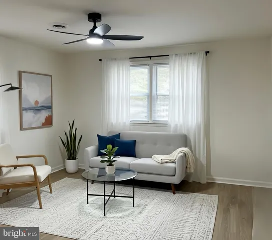 a living room with furniture and window