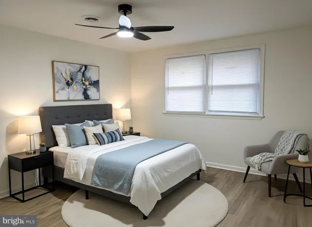 a bedroom with bed and a window