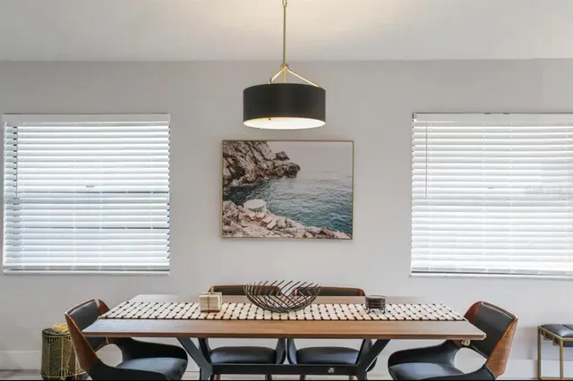 a view of a room with furniture and window