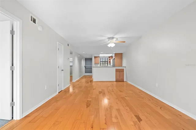 a view of a kitchen with a sink and a refrigerator