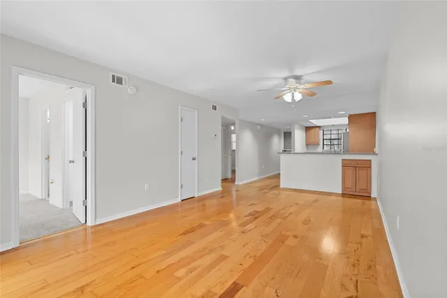 a view of a kitchen with a sink and a refrigerator