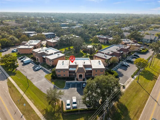 an aerial view of a house with a ocean view