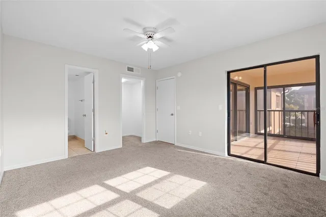 a view of an empty room with a balcony