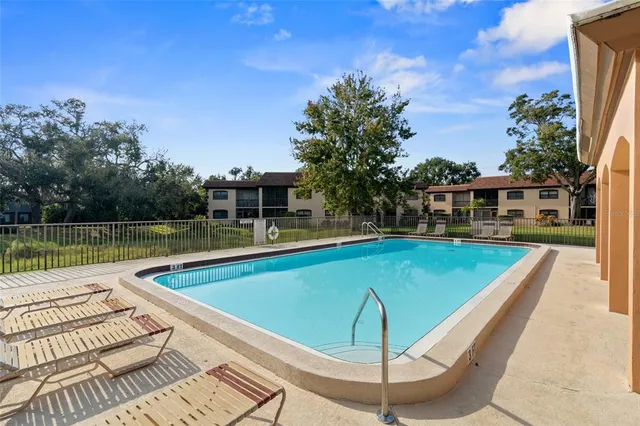 a view of a swimming pool with a patio