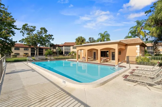 a view of a house with swimming pool