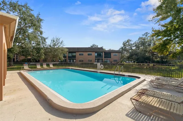 a view of a swimming pool with a lake