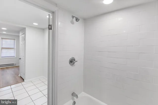 a view of a kitchen from a hallway