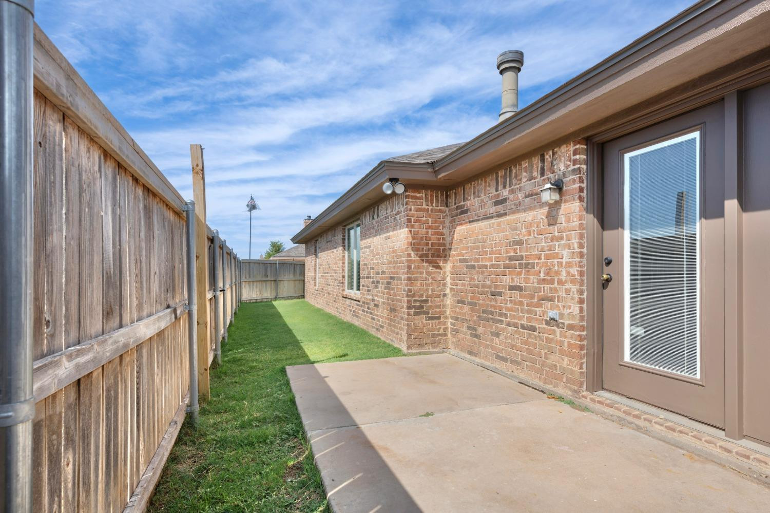 6816 Oakridge Avenue Lubbock, TX 79424 - Photo 19 of 19 a view of a back yard of the house