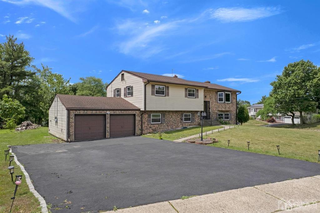 23 Vauxhall Road East Brunswick, NJ 08816 - Photo 13 of 28 a view of an house with backyard and trees