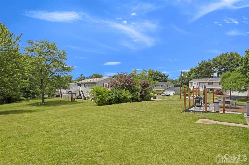 23 Vauxhall Road East Brunswick, NJ 08816 - Photo 17 of 28 a view of a house with a big yard
