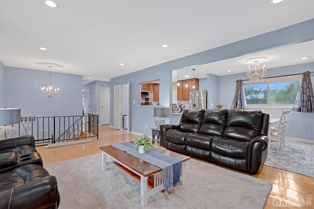 23 Vauxhall Road East Brunswick, NJ 08816 - Photo 19 of 28 a living room with furniture or couch and a wooden floor